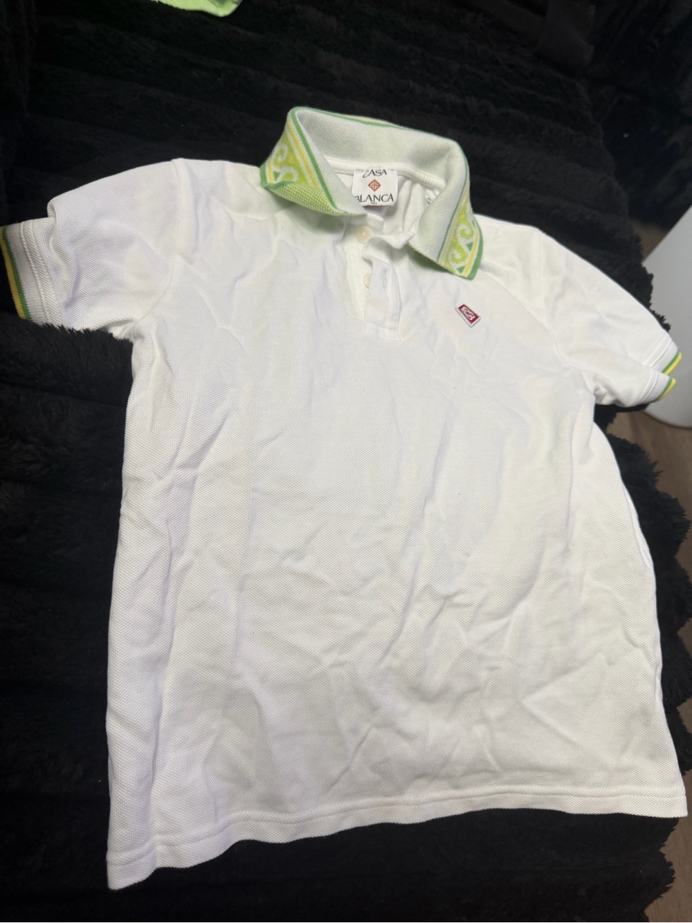 Kids White Polo Shirt with Green Trim and Patterned Collar